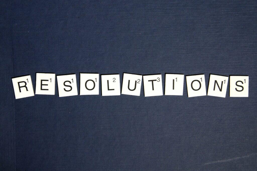 The word resolutions spelled out on scrabble tiles.