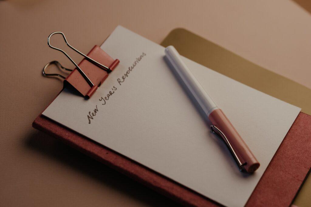 Picture of a journal with New Years resolutions written on the page. 