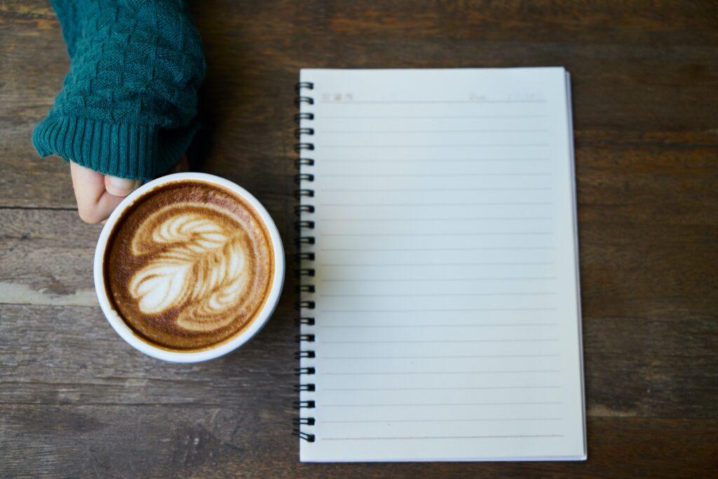 a coffee and a blank shopping list