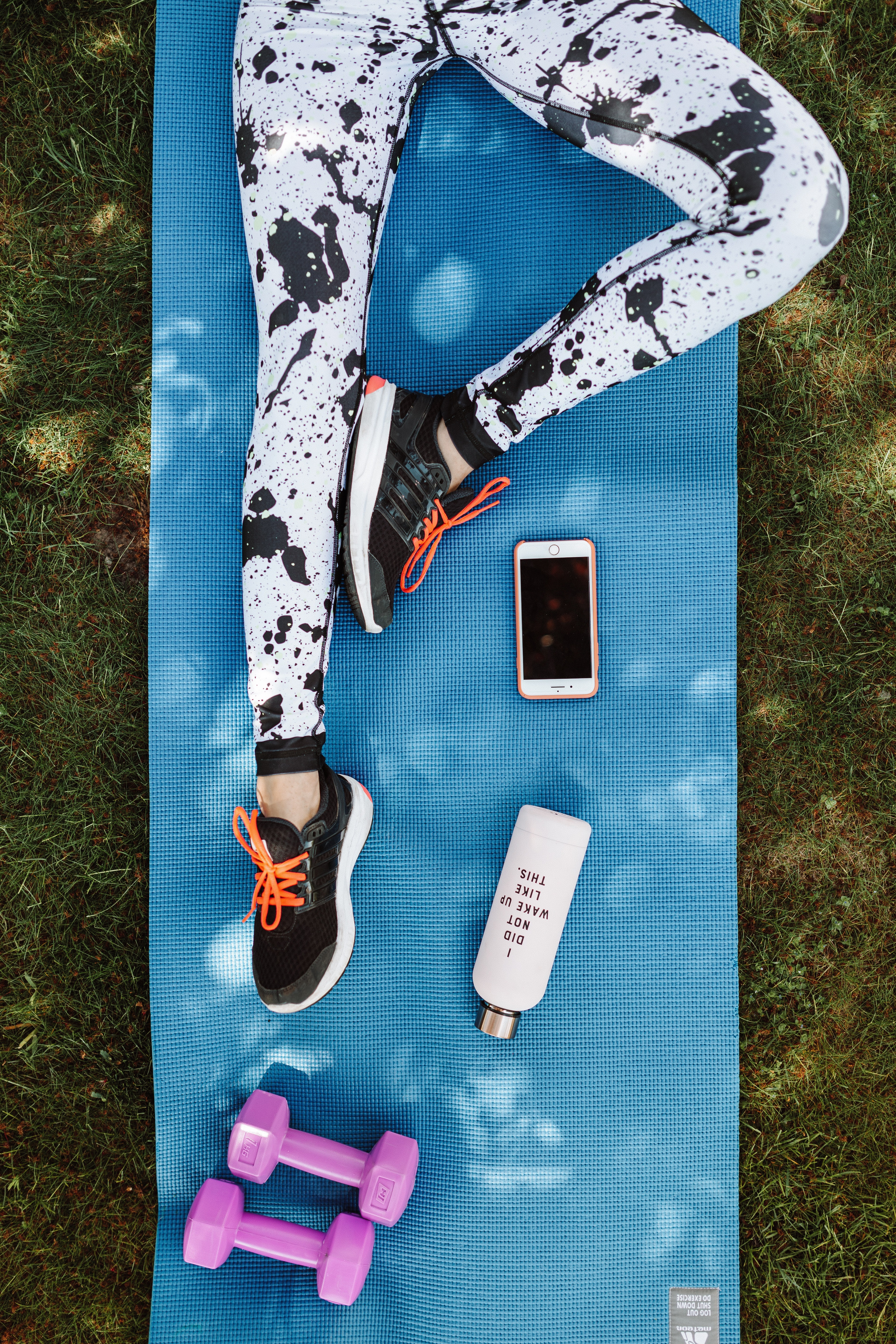 A person's legs on a yoga mat
